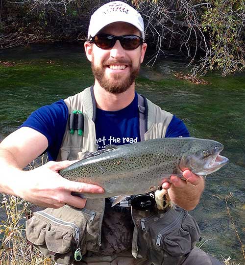 Josh Anspach Hanson, 34, of Albuquerque caught this 23-inch stocked rainbow trout in the below the Red River Fish Hatchery last fall using a Poundmeister fly.