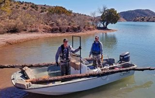 Matt and Eric with log on whaler.