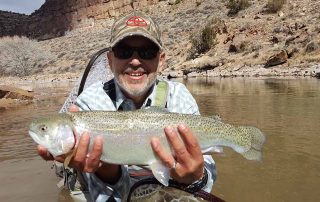 Carlos Vigil with big rainbow caught in improved habitat reach